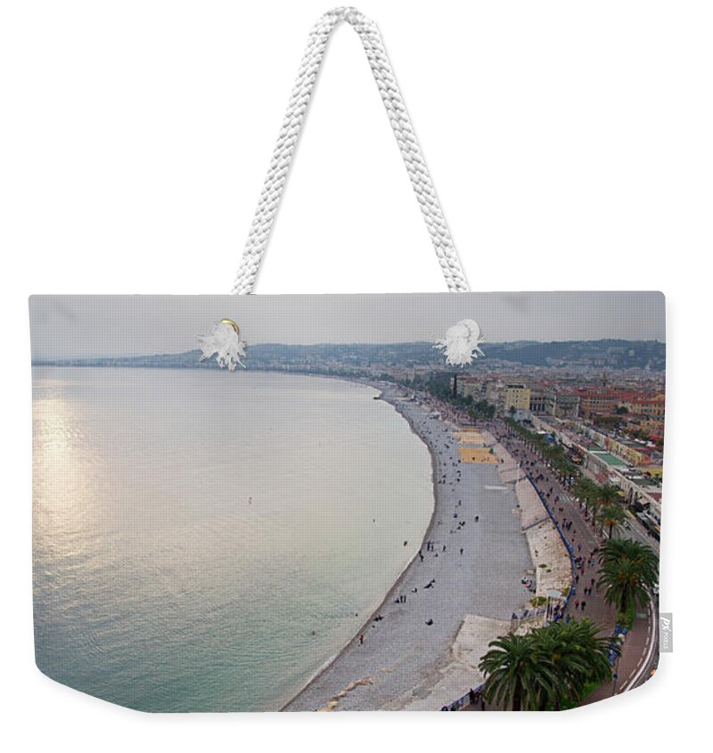 Above Weekender Tote Bag featuring the photograph Sunset over the French Riviera in Nice on a misty evening by Jean-Luc Farges