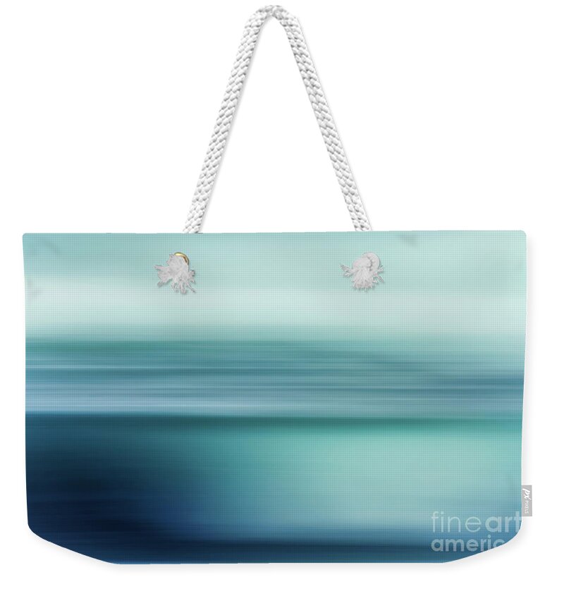 Summer Weekender Tote Bag featuring the photograph Sunset over the sea in light blue by Hanna Tor