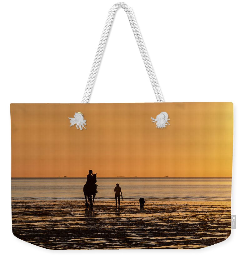 Hoylake Weekender Tote Bag featuring the photograph Sunset Rider by Spikey Mouse Photography