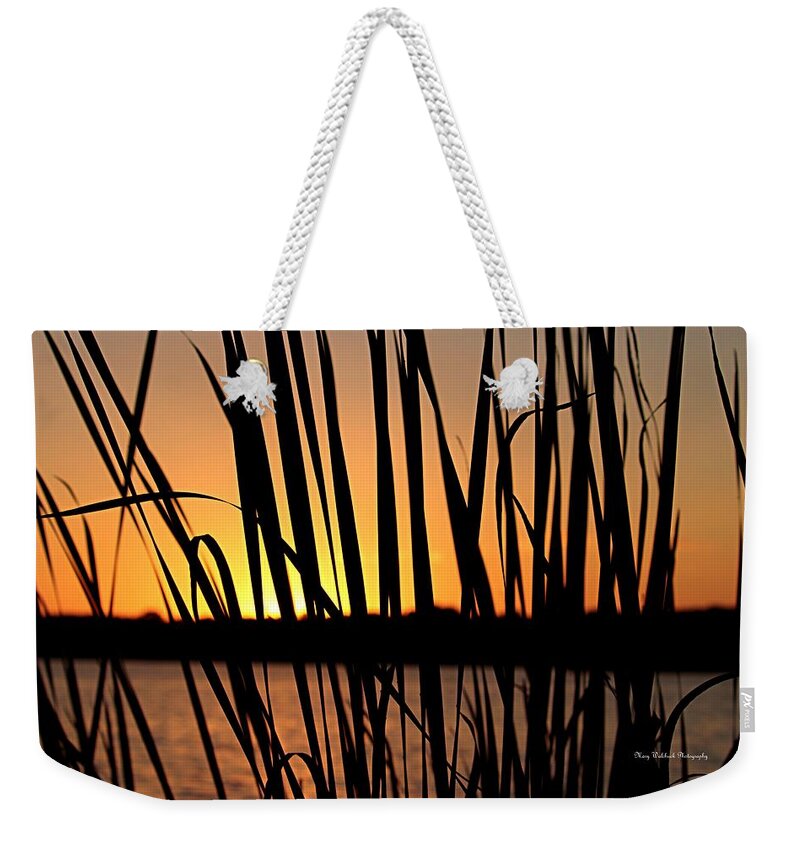 Sunset Weekender Tote Bag featuring the photograph Sunset Through the Reeds by Mary Walchuck