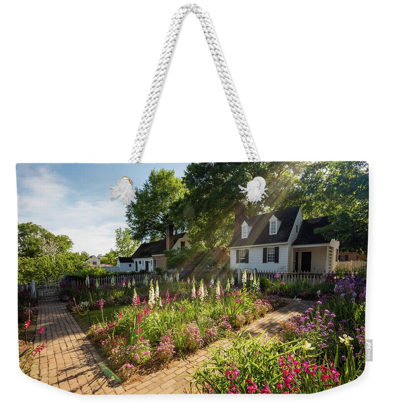Colonial Williamsburg Weekender Tote Bag featuring the photograph Sunshine in Spring at the Taliaferro-Cole Garden by Rachel Morrison