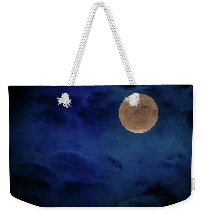 Dramatic Weekender Tote Bag featuring the photograph Super Moon in a Moody Blue Sky by Tim Bryan