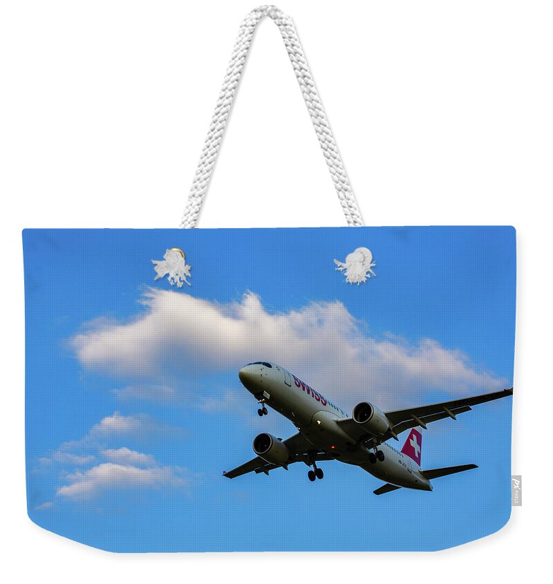 Swiss Air Weekender Tote Bag featuring the photograph Swiss Air airplane landing by Ian Middleton
