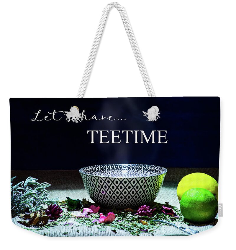 Inscription Weekender Tote Bag featuring the photograph A drinking bowl with tea and herbs. by Bernhard Schaffer