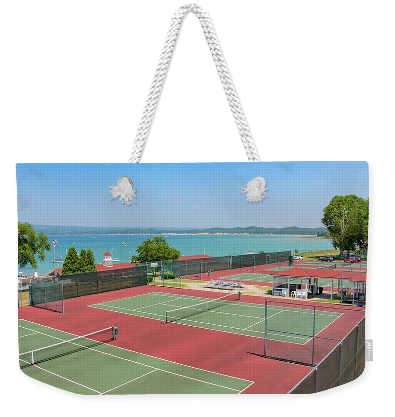Little Traverse Bay Weekender Tote Bag featuring the photograph Tennis Courts on Little Traverse Bay by Robert Carter