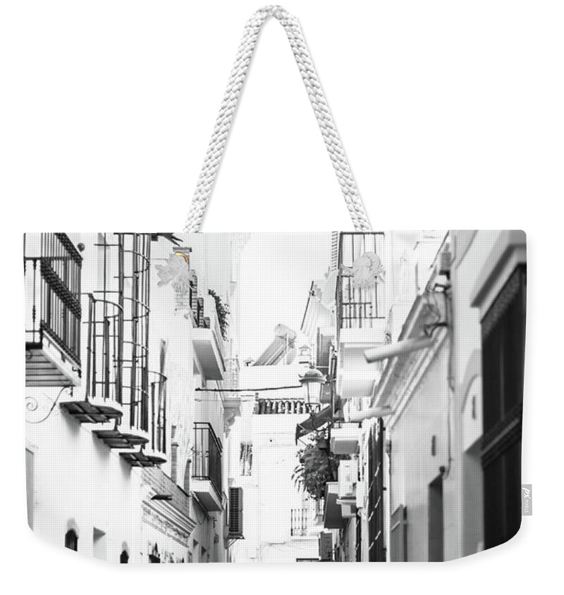Black And White Weekender Tote Bag featuring the photograph The Couple by Naomi Maya