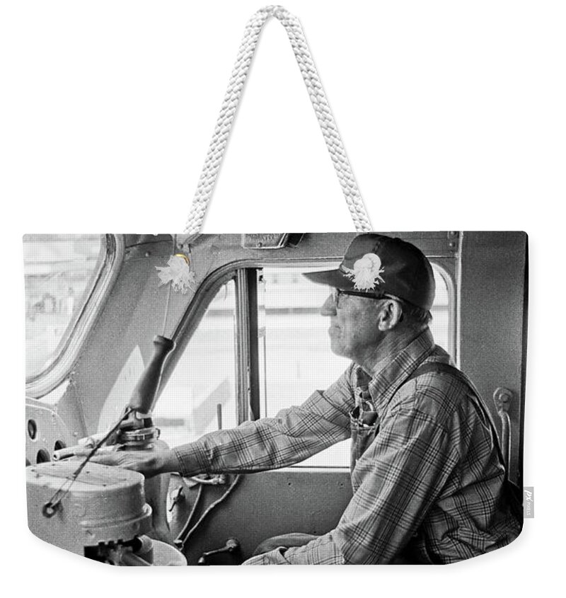 Locomotive Engineer Weekender Tote Bag featuring the photograph The Engineer by Frank DiMarco