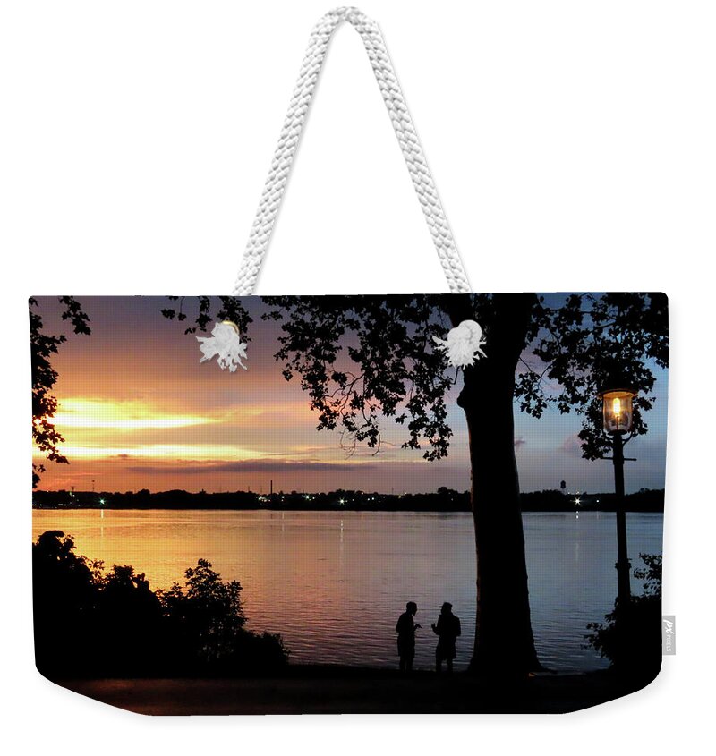 Sunset Weekender Tote Bag featuring the photograph The Evening Chat Along the Delaware River in Riverton, New Jersey by Linda Stern