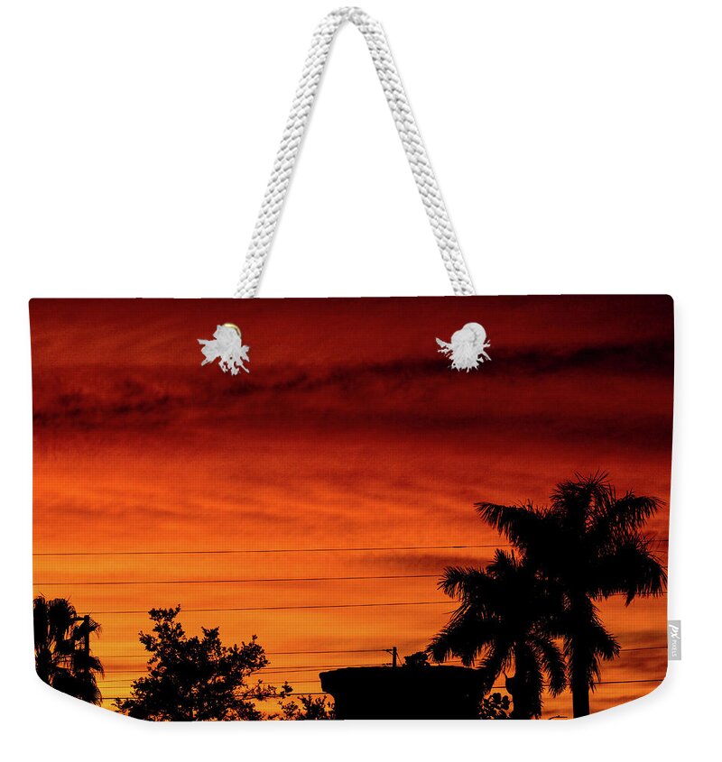 Sunset Weekender Tote Bag featuring the photograph The Fire sky by Daniel Cornell