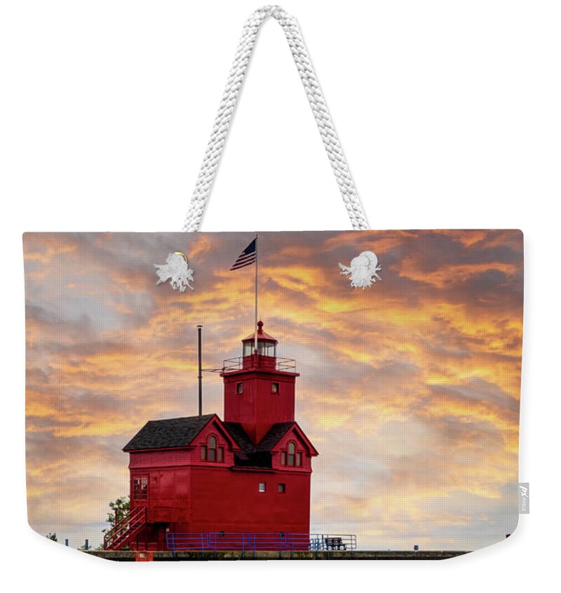 Lighthouse Weekender Tote Bag featuring the photograph The Holland Harbor Lighthouse by Debra and Dave Vanderlaan