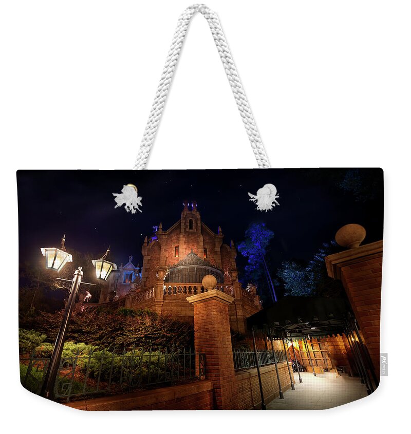 Magic Kingdom Weekender Tote Bag featuring the photograph The House of Leota by Mark Andrew Thomas