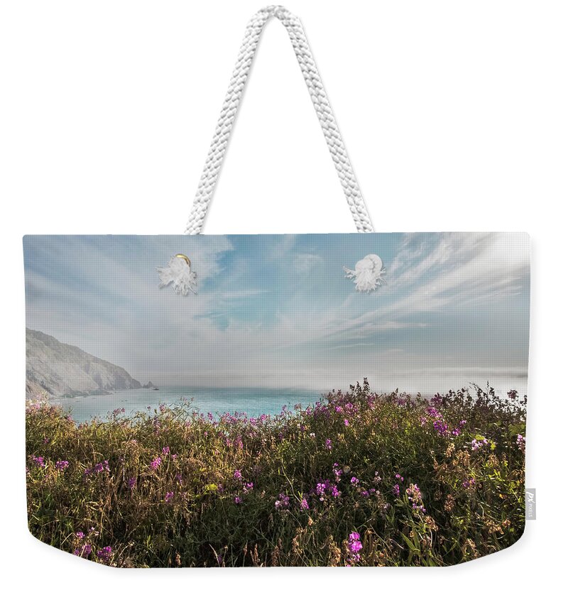 Clouds Weekender Tote Bag featuring the photograph The Pacific Coastline Wildflowers in Soft Hues by Debra and Dave Vanderlaan