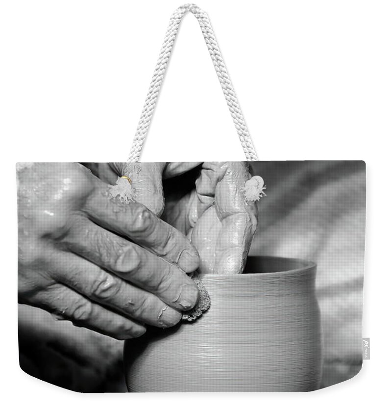Ceramic Weekender Tote Bag featuring the photograph The Potter's Hands bw by Lens Art Photography By Larry Trager