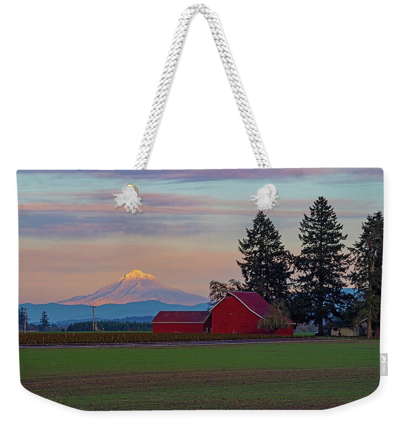  Weekender Tote Bag featuring the photograph The red barn and the mountain. by Ulrich Burkhalter