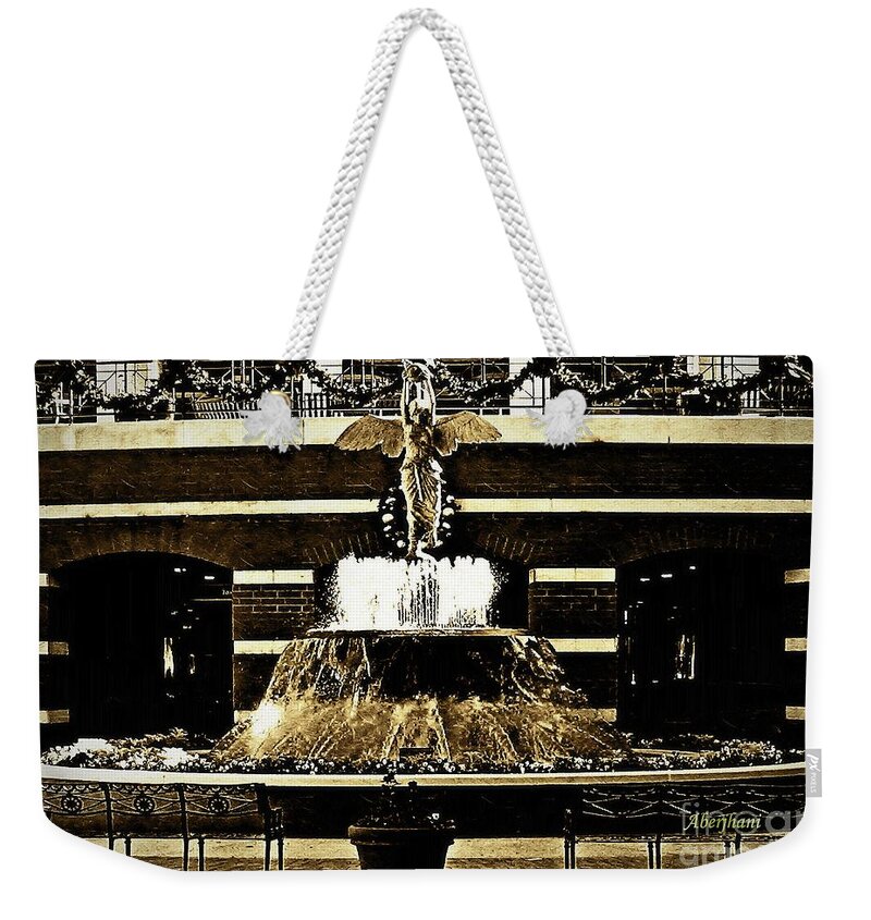 Sepia Weekender Tote Bag featuring the photograph The Sepia Angel of Flight Fountain by Aberjhani