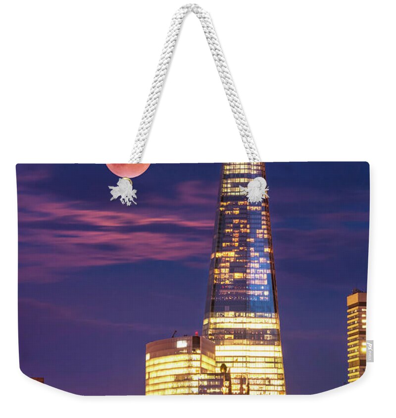 London Weekender Tote Bag featuring the photograph The Shard and red moon, London by Neale And Judith Clark