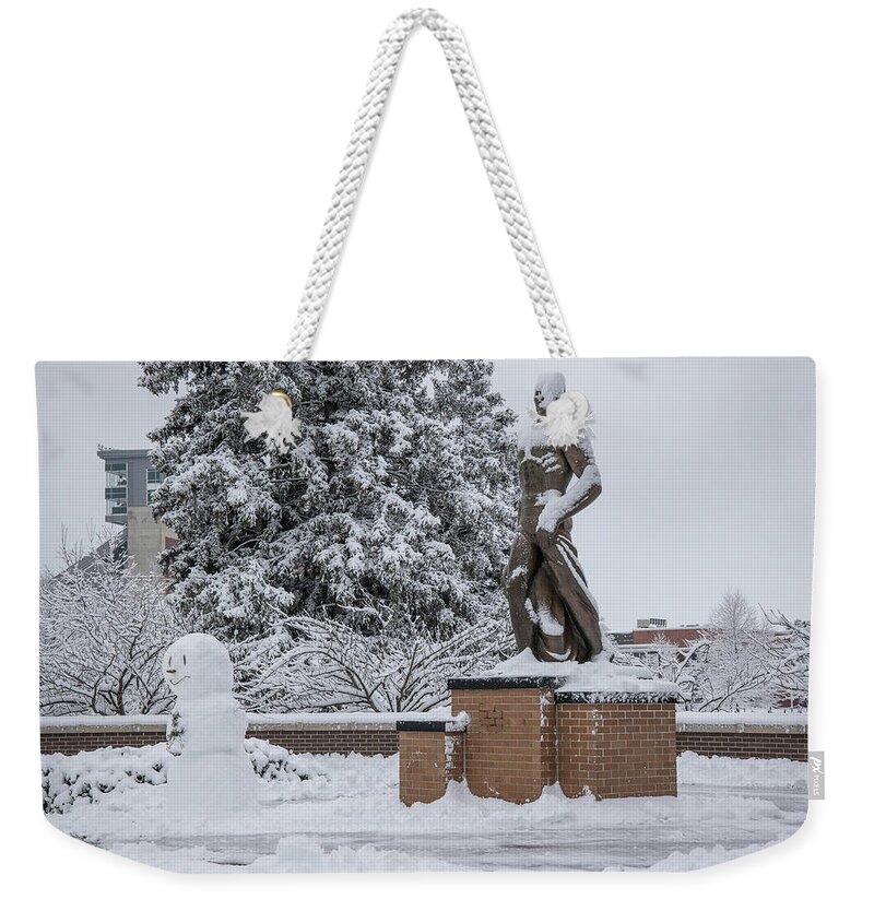 East Lansing Weekender Tote Bag featuring the photograph The Spartan Statue and Friend by John McGraw