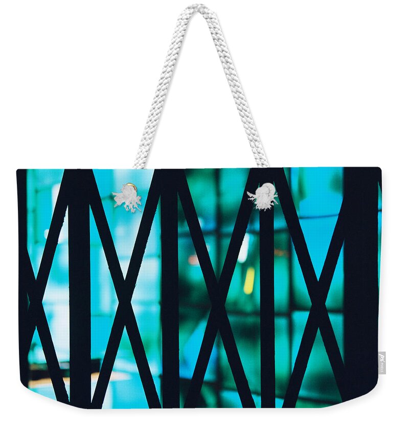 Closed Weekender Tote Bag featuring the photograph The store is closed but it's still alive by Barthelemy De Mazenod