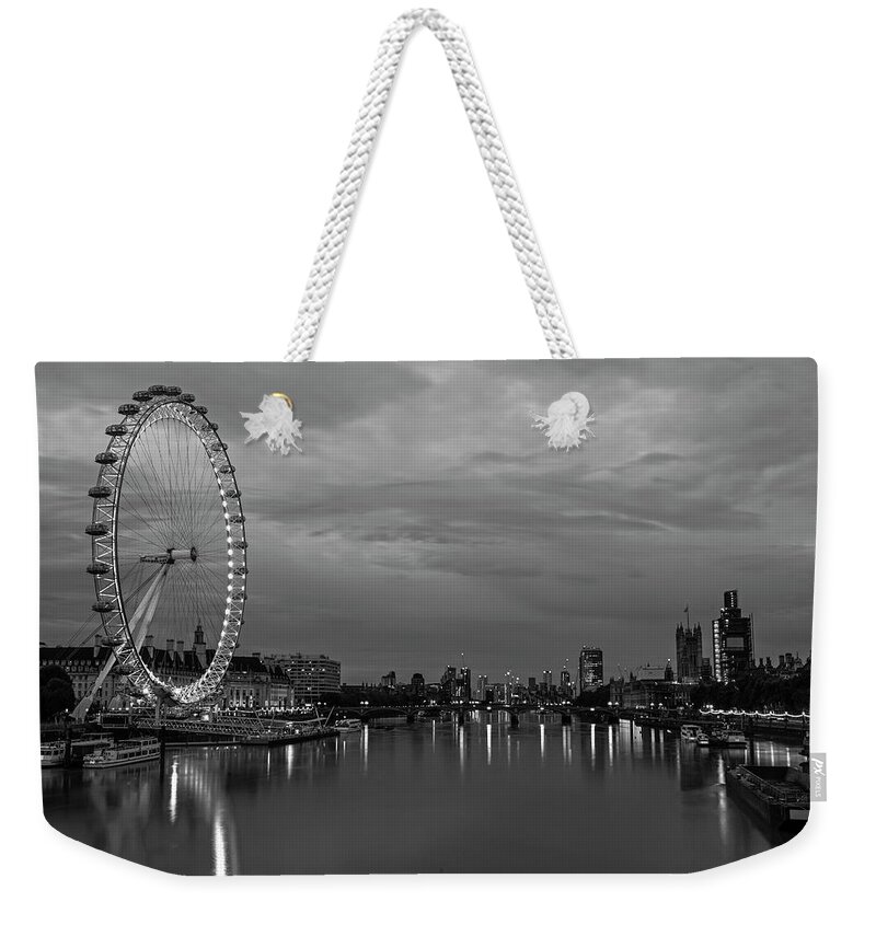 London Weekender Tote Bag featuring the photograph The Thames River London Eye England UK Dramatic Sky Black and White by Toby McGuire