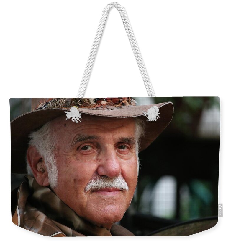 The Man Weekender Tote Bag featuring the photograph They Call Him The Man by Philip And Robbie Bracco