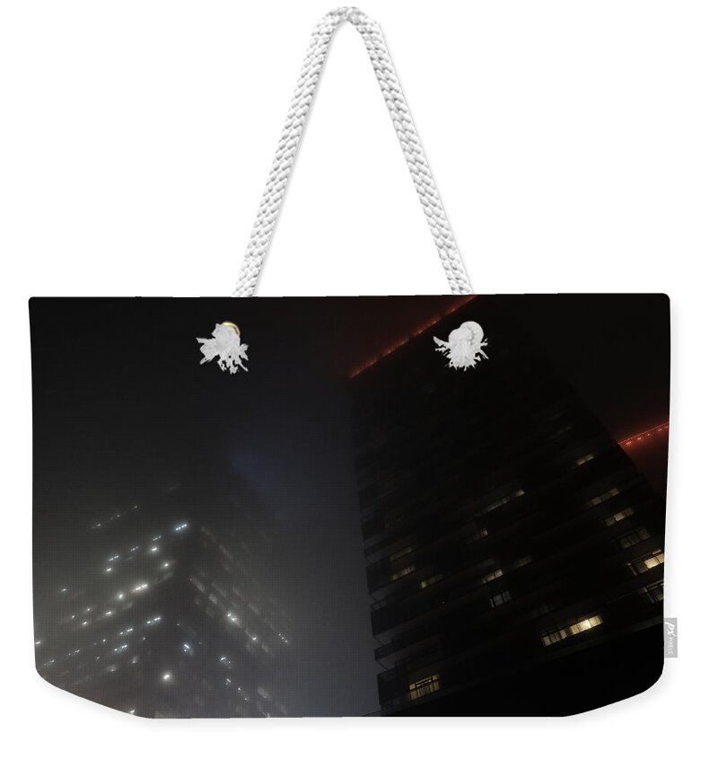 Night Weekender Tote Bag featuring the photograph They Disappear At Night by Kreddible Trout