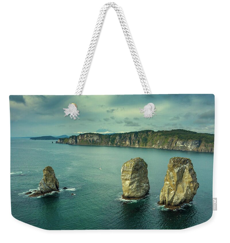 Rock Weekender Tote Bag featuring the photograph Three brother rocks in Avacha bay by Mikhail Kokhanchikov