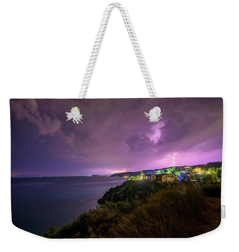 Thunderstorm Weekender Tote Bag featuring the photograph Thunderstorm over a Village on the Seashore by Alexios Ntounas