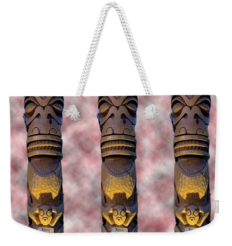 Tiki Weekender Tote Bag featuring the digital art Tikis on Fire at Dusk by Matthew Bamberg