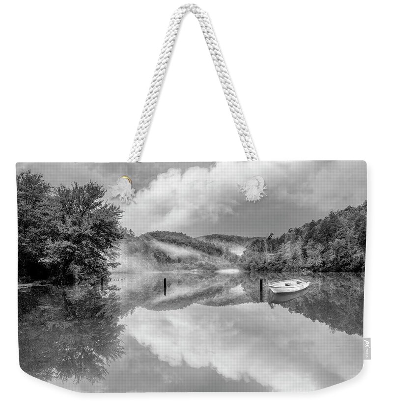 Carolina Weekender Tote Bag featuring the photograph Touch of Fog on the Lake Black and White by Debra and Dave Vanderlaan