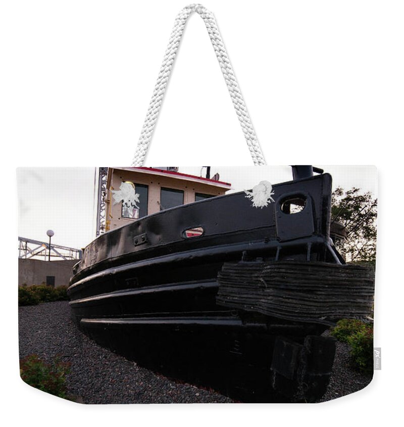 Tugboat Weekender Tote Bag featuring the photograph Tugboat and Aerial Lift Bridge in Background Duluth Minnesota by Nikki Vig