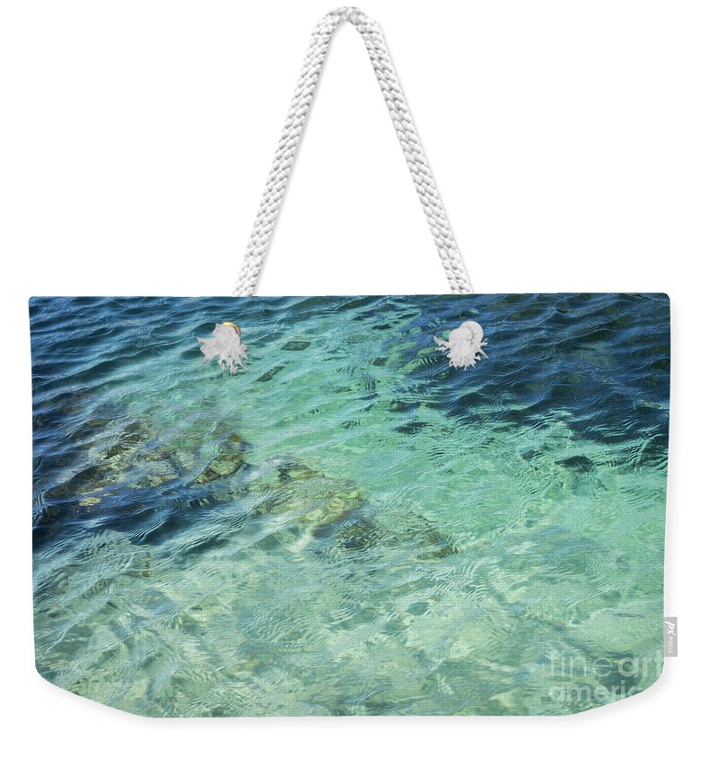 Turquoise Weekender Tote Bag featuring the photograph Turquoise Blue Water And Subtle Waves by Adriana Mueller