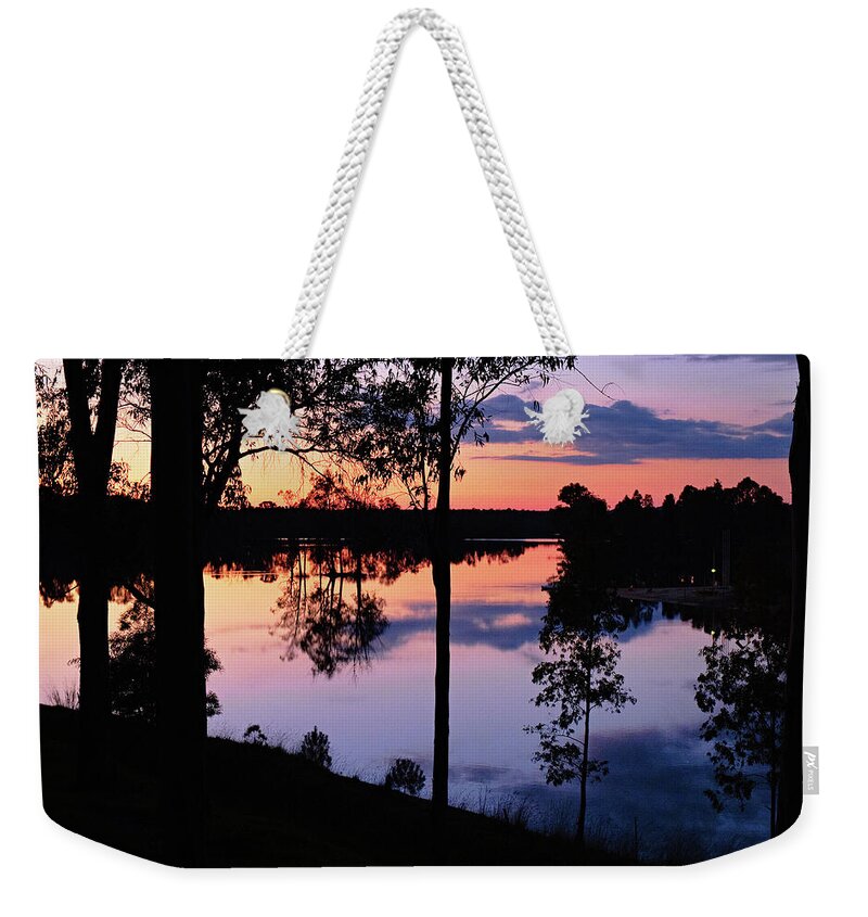 Twilight Weekender Tote Bag featuring the photograph Twilight by the lake by Angelo DeVal