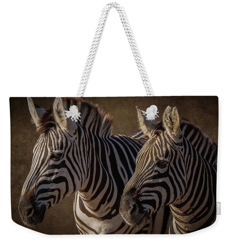 Two Zebras Weekender Tote Bag featuring the digital art Two zebras by Marjolein Van Middelkoop