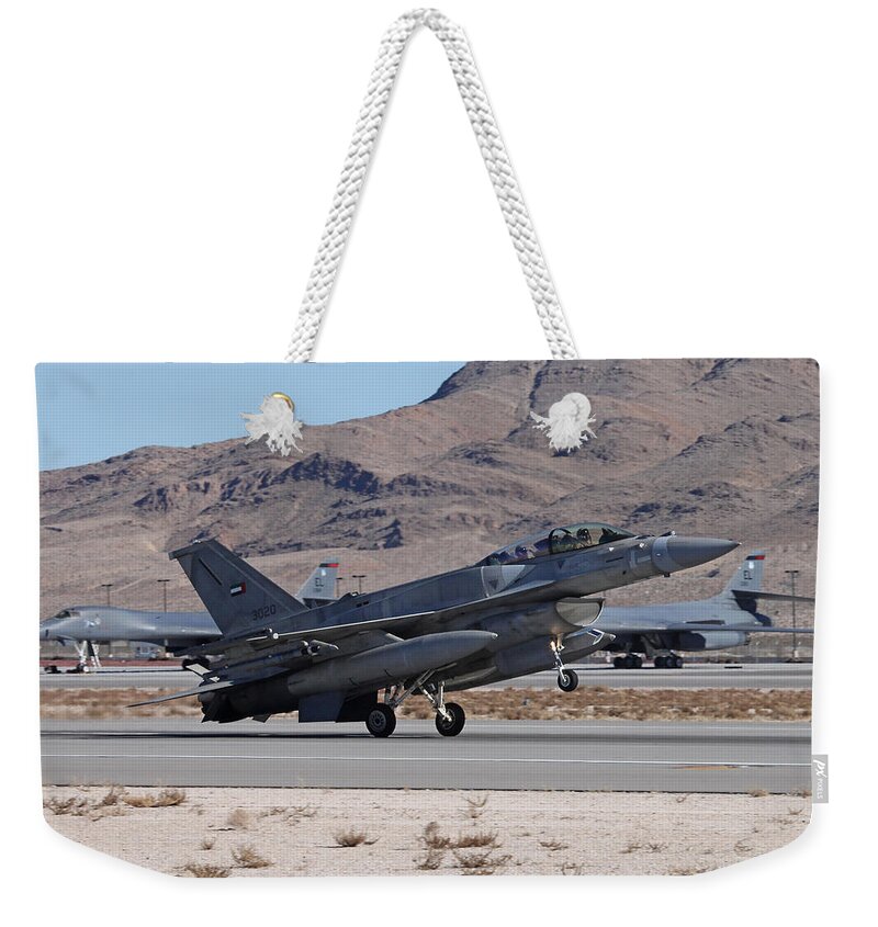 Falcon Weekender Tote Bag featuring the photograph UAE Block 60 F-16F Recovering to 21L, Nellis AFB by Custom Aviation Art