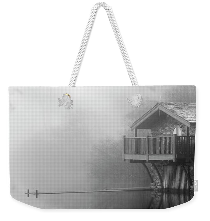 Panorama Weekender Tote Bag featuring the photograph Ullswater boat house in the mist black and white lake district by Sonny Ryse