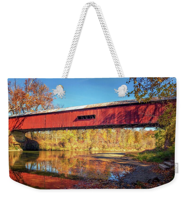 Parke County Weekender Tote Bag featuring the photograph Under Cox Ford Bridge in Autumn by Susan Rissi Tregoning
