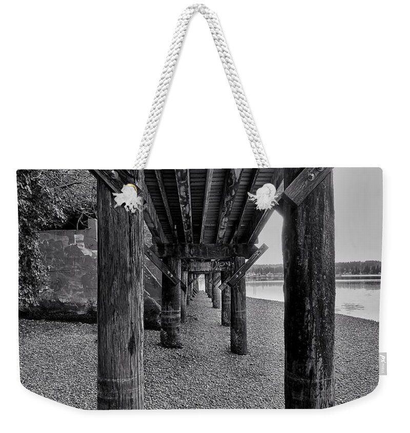 Black And White Weekender Tote Bag featuring the photograph Under the Boardwalk - Poulsbo bw by Jerry Abbott