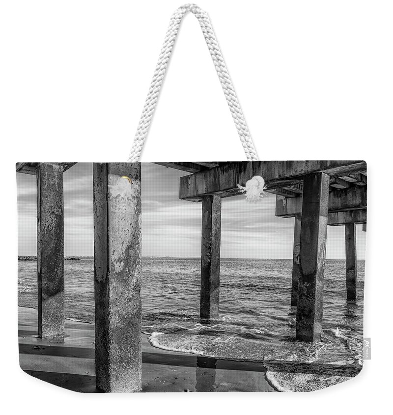 Greyscale Weekender Tote Bag featuring the photograph Under the Pier at Coney Island by Cate Franklyn