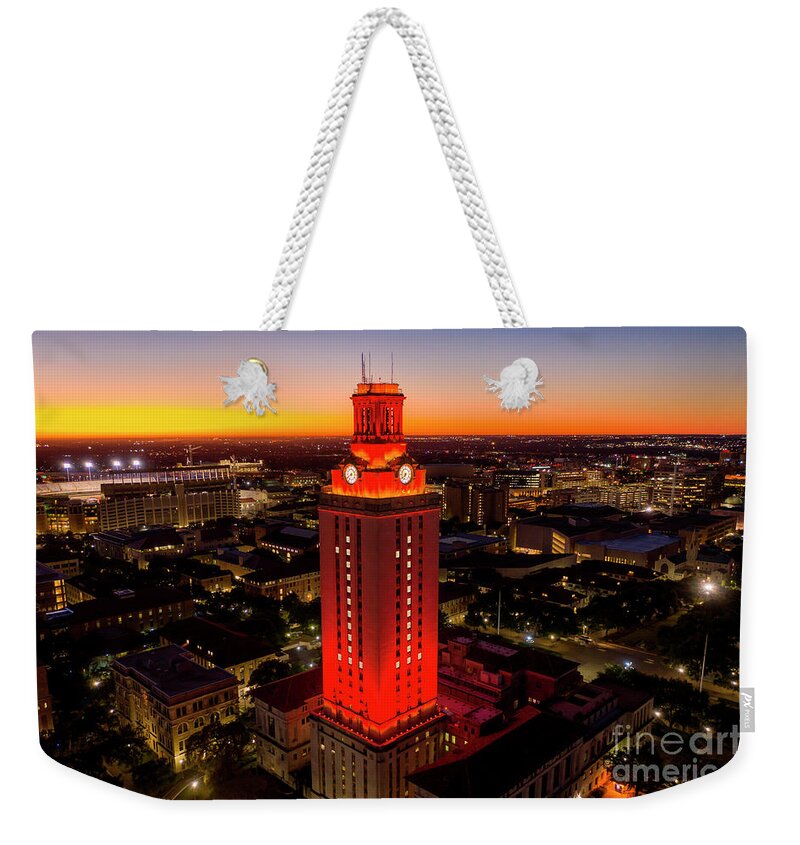 Texas Texas Weekender Tote Bag featuring the photograph University of Texas Tower lit with Number 1 bright Orange Tower by Dan Herron