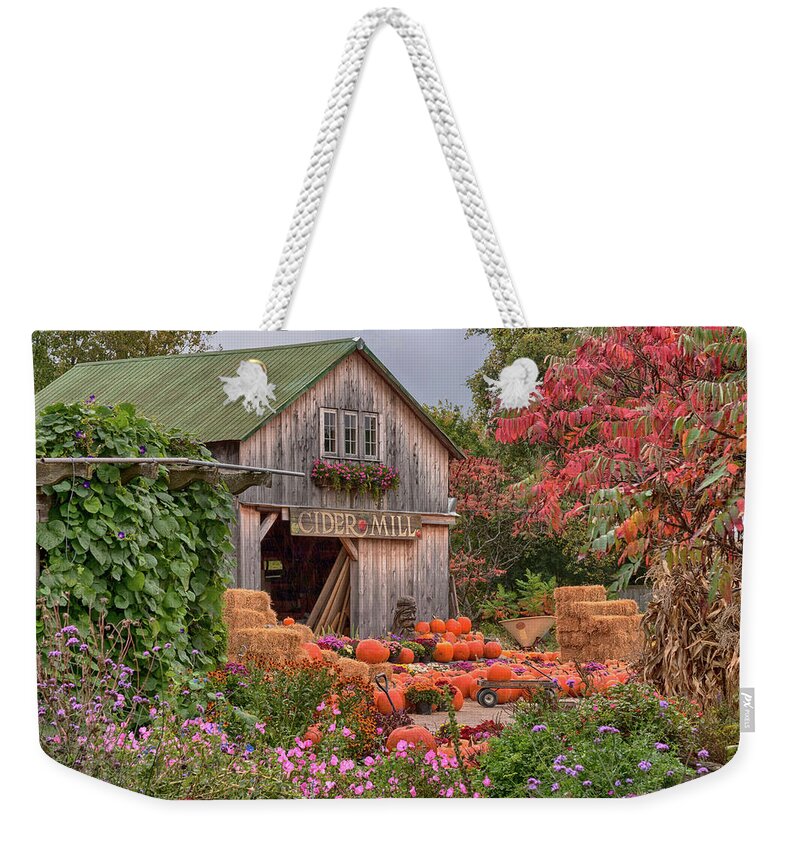 Hudak's Weekender Tote Bag featuring the photograph Vermont pumpkins and autumn flowers by Jeff Folger