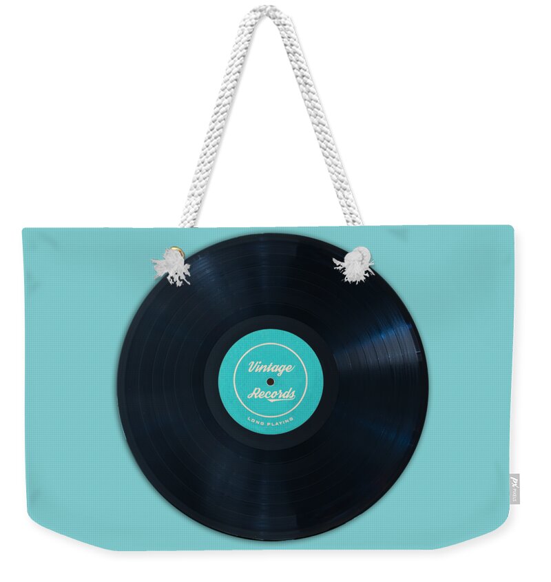Vinyl Weekender Tote Bag featuring the photograph Vinyl record by Delphimages Photo Creations