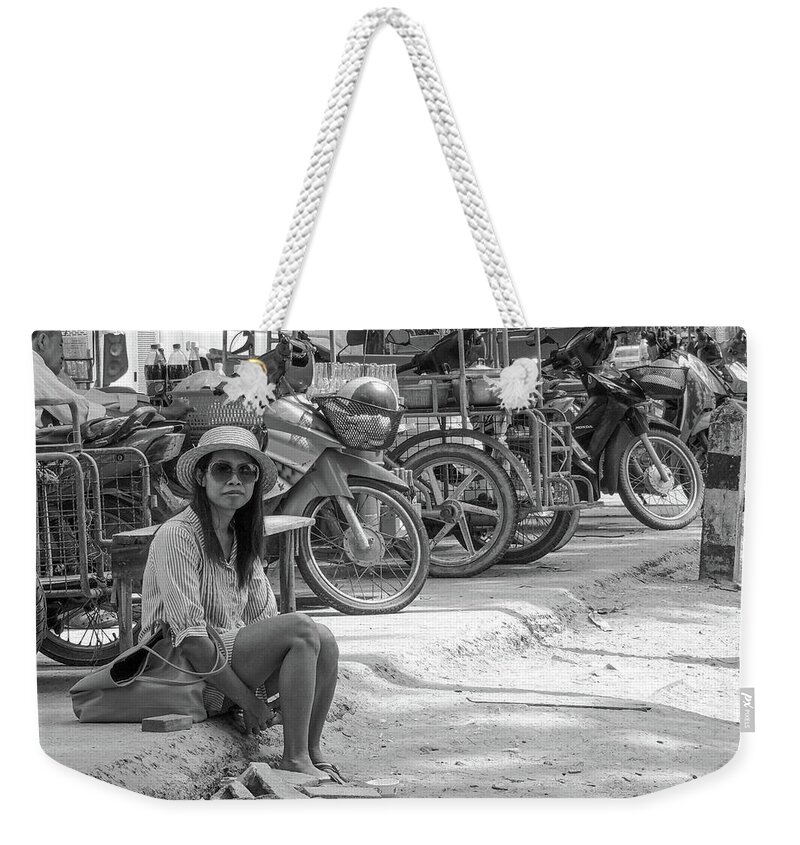 Bike Weekender Tote Bag featuring the photograph Waif - Poor destitute girl waiting for a lift sitting in the gut by Jeremy Holton