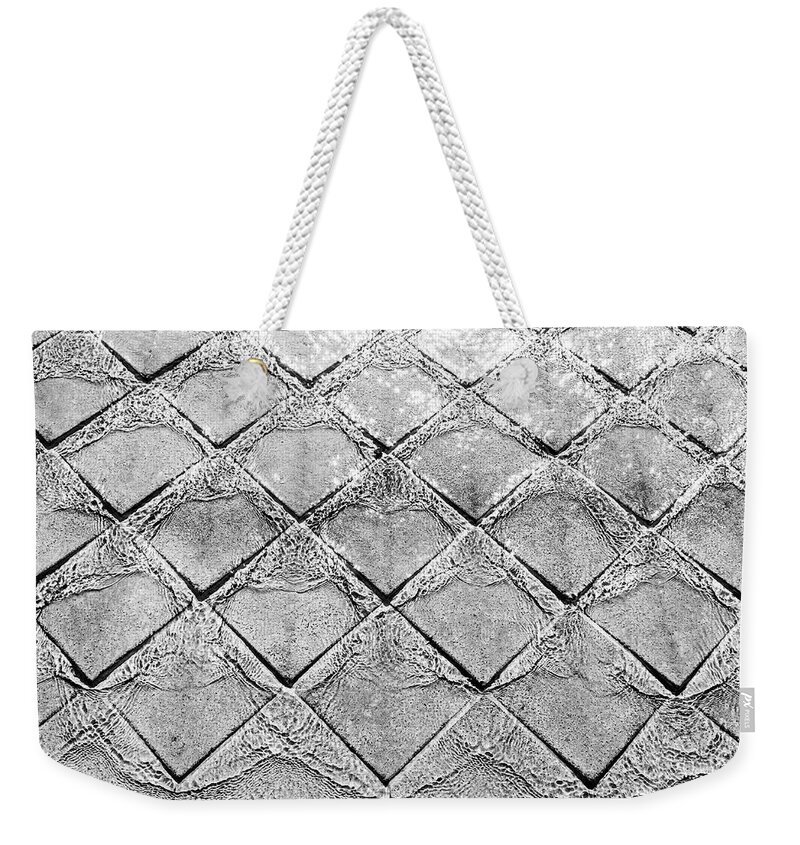 Water Weekender Tote Bag featuring the photograph Water flowing on stones of fountain by Viktor Wallon-Hars