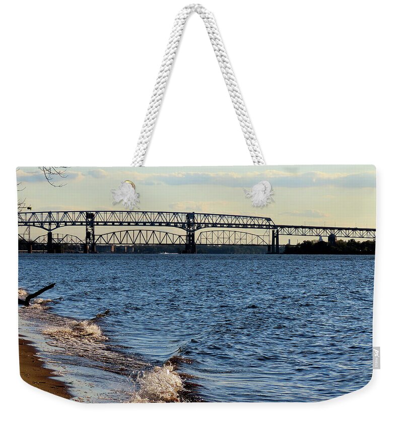 River Weekender Tote Bag featuring the photograph Waves Lapping the Shore of the Delaware River Near Betsy Ross and Delair Memorial Railroad Bridges by Linda Stern