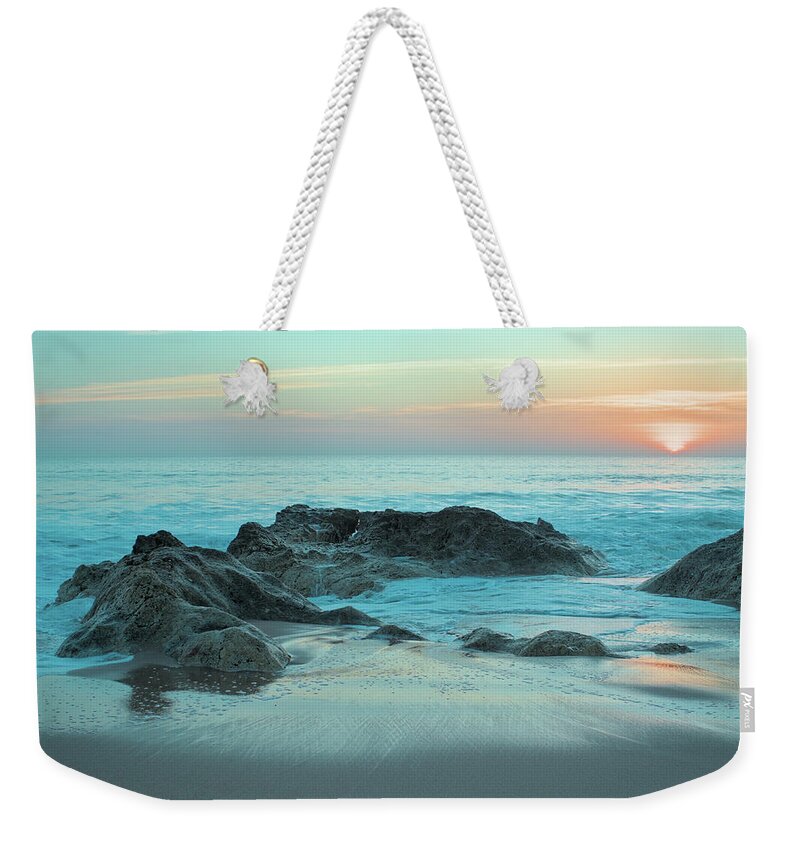 Beach Sunset Weekender Tote Bag featuring the photograph Waves, rocks and sunset in Salgados by Angelo DeVal