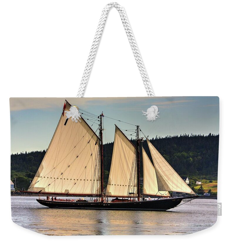 The Bluenose Ll Out Of Lunenberg Nova Scotia En Route To Digby Nova Scotia Via Petit Passage Bay Of Fundy Sea Oceans Ships Sail Land Water Clipper Weekender Tote Bag featuring the photograph We are sailing by David Matthews