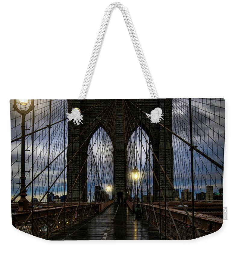 Streetlights Weekender Tote Bag featuring the photograph Wet Day On The Brooklyn Bridge by Chris Lord