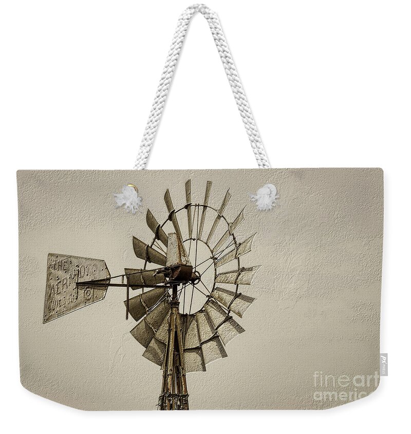 Windmill Weekender Tote Bag featuring the photograph Wheel Of A Windmill Sepia by Jennifer White