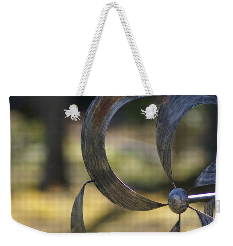 Weekender Tote Bag featuring the photograph Whirligig by Heather E Harman