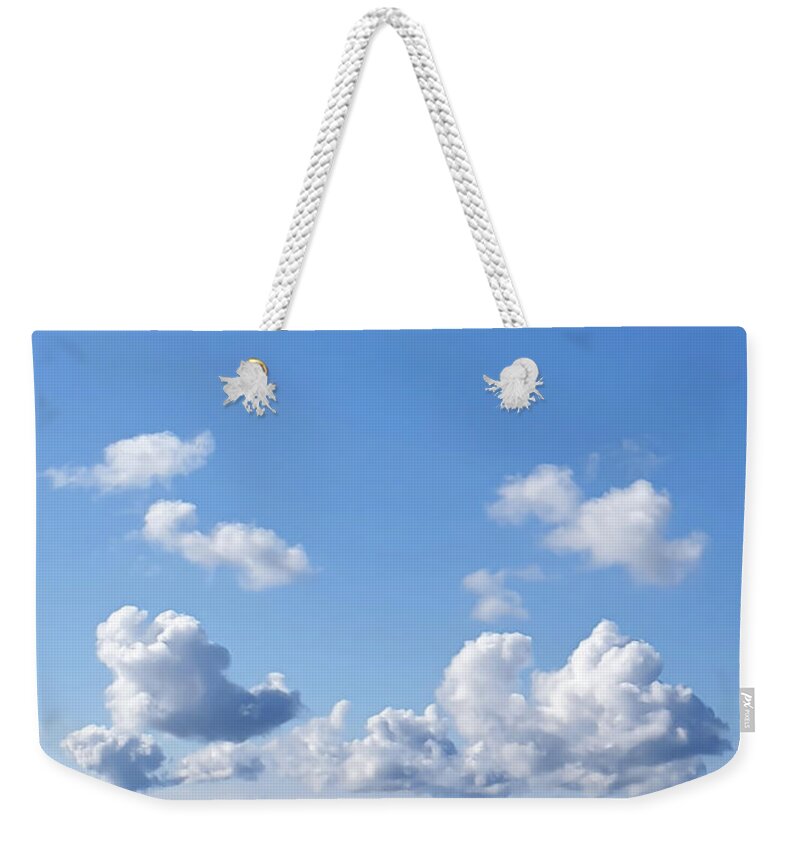 Blue Weekender Tote Bag featuring the photograph White Clouds and Blue Skies by Nicklas Gustafsson